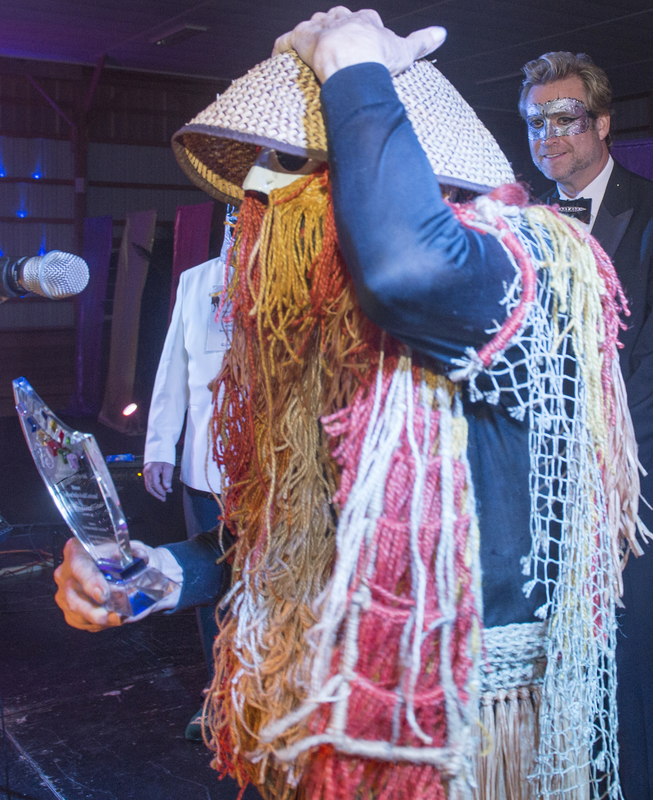 Francis Huber accepts his award for best individual costume. He created this years ago for another Beaux Ball. BY DENY HOWETH